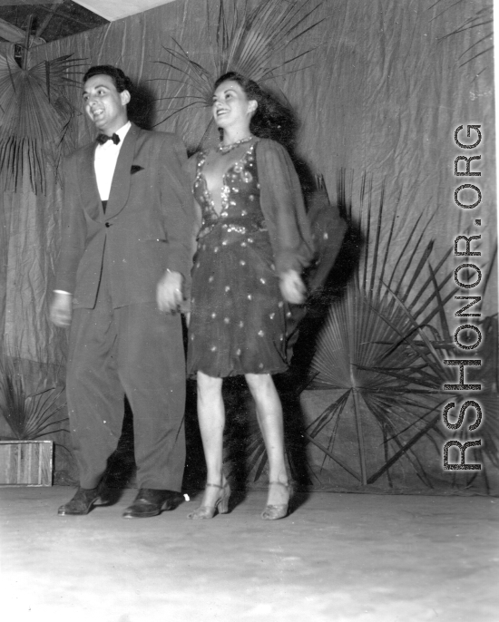 Dancing at a USO show in Gushkara, India, during WWII.  The boxes in front of the band players are labeled 748th ROB (748th Railway Operating Battalion).