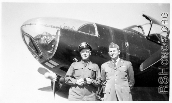 Two American flyers with A-26C Invader warplane. Seymour Mazer on the left.  The 491st began converting to the A-26 in late July 1945. However, the 491st planes would likely not have been all black (i.e., a night intruder aircraft) which typically was not done until Korea-era. Mazer would have been navigator, the other officer wears pilot's wings.  (Thanks Tony Strotman for additional info.)