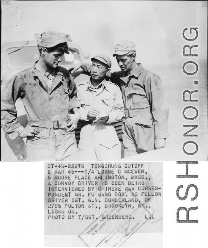 At the Tengchong cutoff: T/4 Lorne C. McEwen, a convoy driver, is seen being interviewed by Chinese war correspondent Mr. Fu Gang-bor, as fellow driver Sgt. G. N. Cumberland looks on.  Yunnan Province on March 4, 1945.  Photo by T/Sgt. Greenberg.  Passed by William E. Whitten.