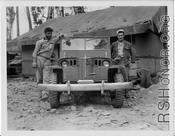 GIs of the 797th Engineer Forestry Company in Burma, pose with a jeep that has had chrome grill and bumper added on.  During WWII.