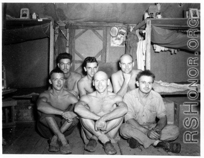 Engineers of the 797th Engineer Forestry Company pose in their barracks in Burma.  During WWII.