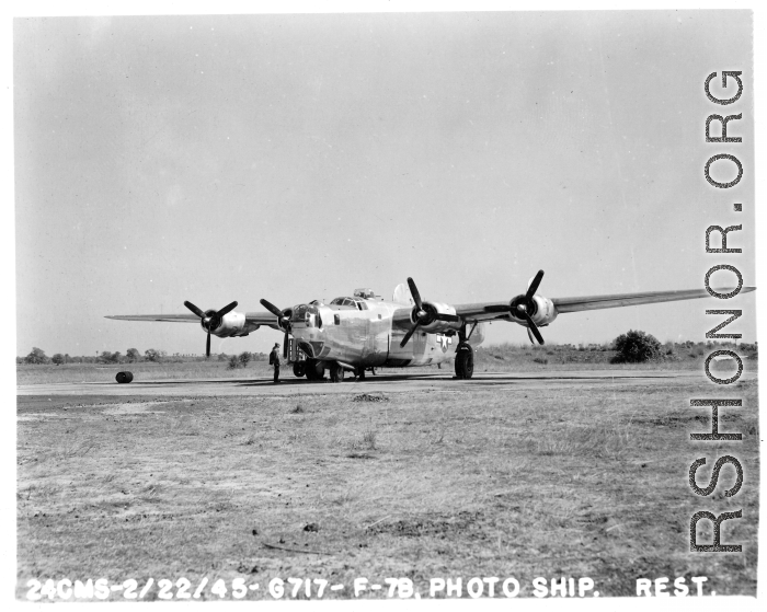 Loading film into 24th Mapping Squadron F-7A, #441678, from photographic equipment carrying trailer. February 22, 1945.