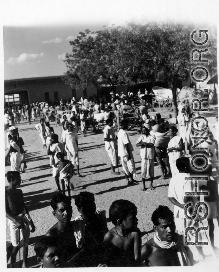 Busy market area.  Scenes in India witnessed by American GIs during WWII. For many Americans of that era, with their limited experience traveling, the everyday sights and sounds overseas were new, intriguing, and photo worthy.