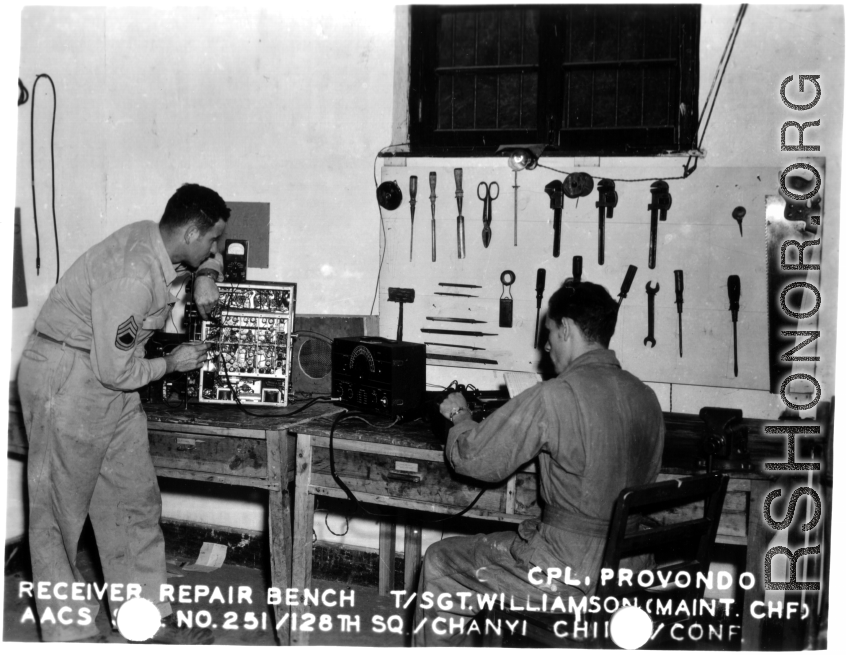 Cpl. Provondo and Sgt. Williamson work at the receiver repair bench at Chanyi, China, during the Second World War.   AACS Sta. No. 251, 128th Squadron, Chanyi, China.