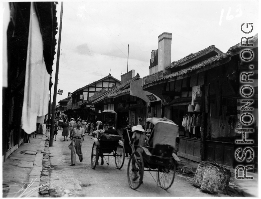 A pleasant market street in China, probably Kunming, during WWII.