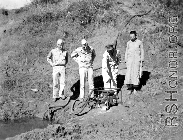 American and Chinese personnel pumping water near an American base, China, during WWII.  From the collection of Wozniak, combat photographer for the 491st Bomb Squadron, in the CBI.