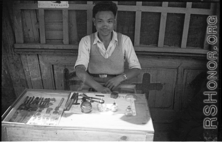A local watch repair stand in SW China during WWII.