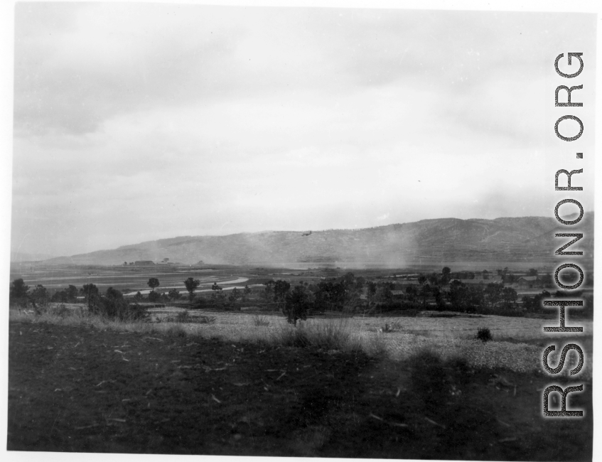 An American transport plane over a base in China during WWII, either Luliang or Yangkai.