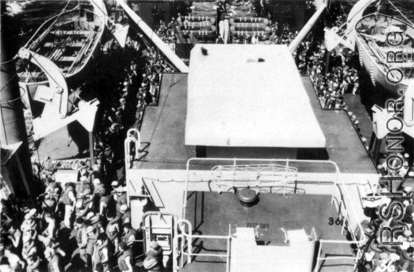 Life-jacketed GIs on ship on the way back to the US after the war. The ship is probably the SS Marine Raven.