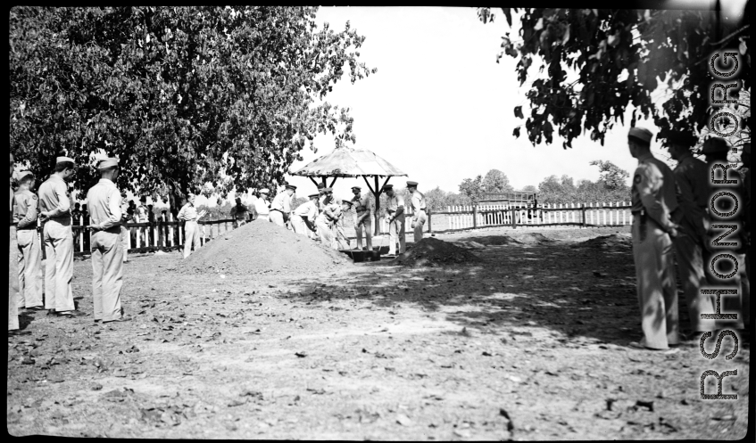 Solemn burial ceremony for American GIS who had died at a temporary war-time graveyard. In the CBI, during WWII.