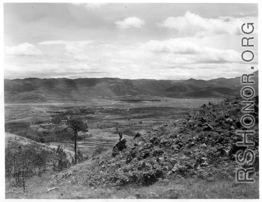 An American serviceman walking  on the hill above Yangkai air base, in Yunnan province, China, during WWII.