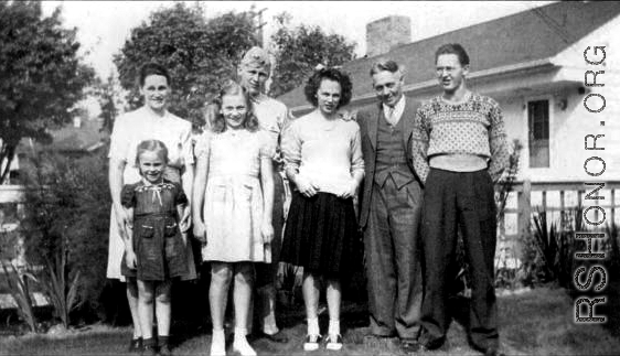 Clarence I. Anderson, Pvc., Service No. 19059691, in the back row in uniform in 1943, in Seattle, WA, with his younger brother and three younger sisters, as well as his mother Ester (far left) and father Ivan (second from the right). 