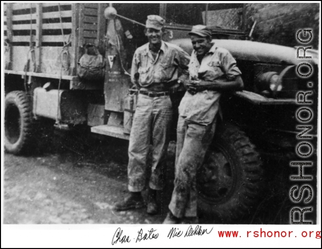 American GIs and transport truck roadside in the CBI during WWII: Charles Bates and Nic Dekker.