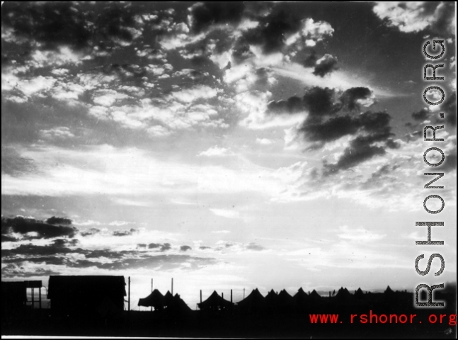 Tents for GIs at the American base at Liuzhou during WWII, silhouetted against the sunset.