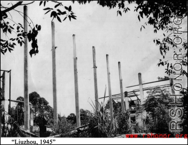 Bob Riese and friend explore remains of aircraft factory and hangers at the air base at Liuzhou, in 1945. The facilities at the base were first destroyed by the Chinese and Americans during retreat in the face of Ichigo during the fall of 1944, then may have been destroyed more by American bombardment during Japanese occupation, and possibly destroyed more by the Japanese as they retreated the area in 1945.