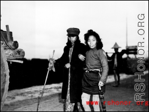 Chinese refugees walking during summer/fall 1944, fleeing the Japanese advance during Ichigo. In Guangxi province, China, during WWII.
