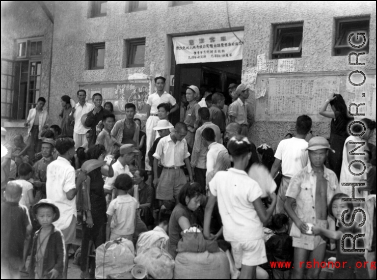 This is the Liuzhou city (Guangxi province) railway station during the evacuation as the Japanese advanced on the city in the fall of 1944. Notice that the picture quality is high enought to read the advertisements, slogans, and messages, left on the wall behind the crowd