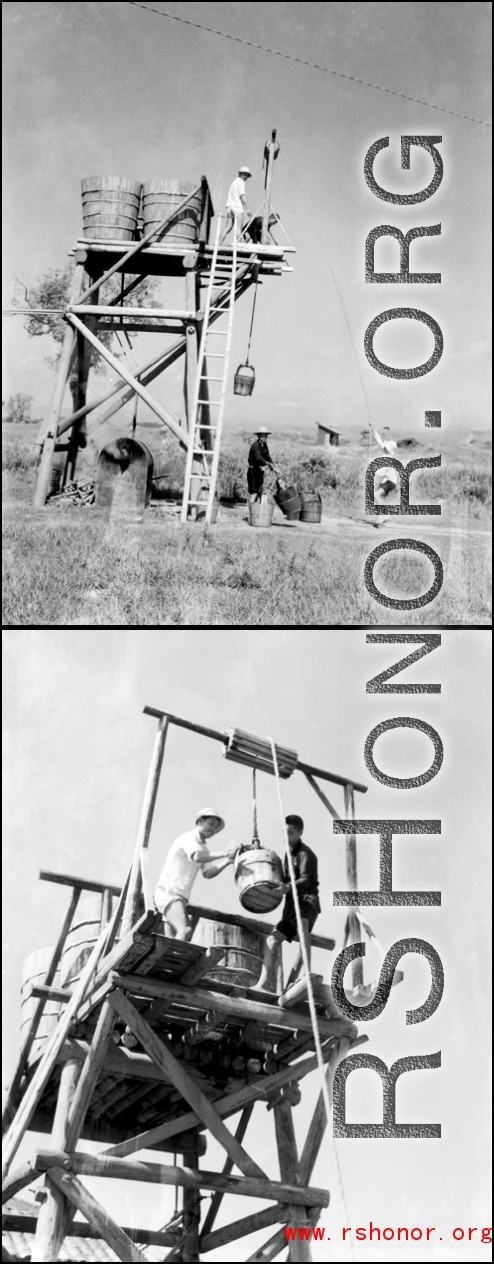 Workers in China load raised water storage tanks by hand via pails and rope lifts. Below is a boiler heating the water. At an American military base in China. During WWII.