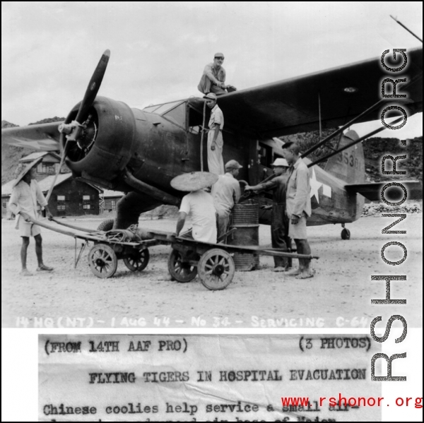 Chinese workers help service a C-64, loading fuel by hand crank, on August 1, 1944, somewhere in the China. 