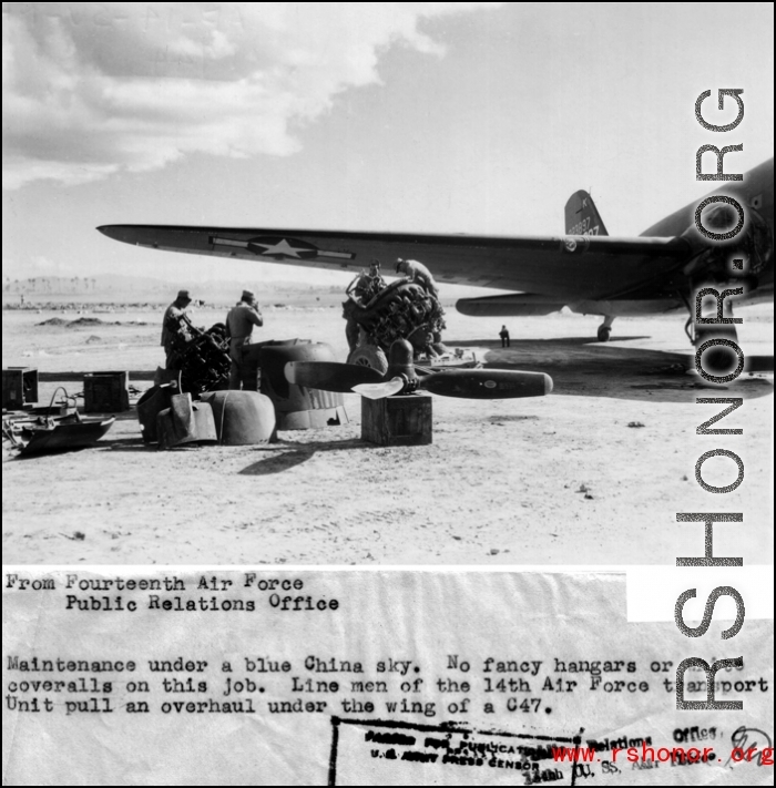 Maintenance under a blue China sky. No fancy hangers or white coveralls for this job. Line men from the 14th Air Force transport unit pull an overhaul under the wing of a C-47.