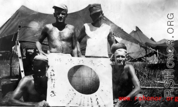 GIs show off trophy captured Japanese Good-Luck Flag  (寄せ書き日の丸) collected on the battleground in the CBI during WWII.