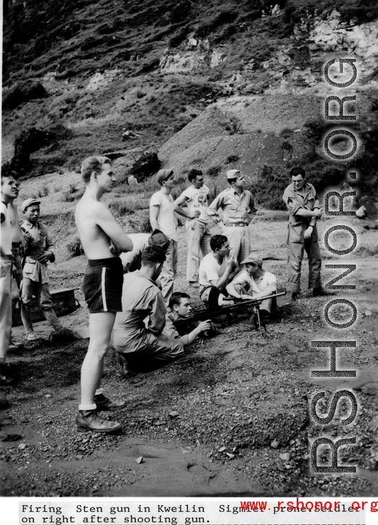 Firing Sten gun in Kweilin (Guilin, Guangxi province, China) during WWII.  Sigmeir prone, Seidler on right after shooting gun.