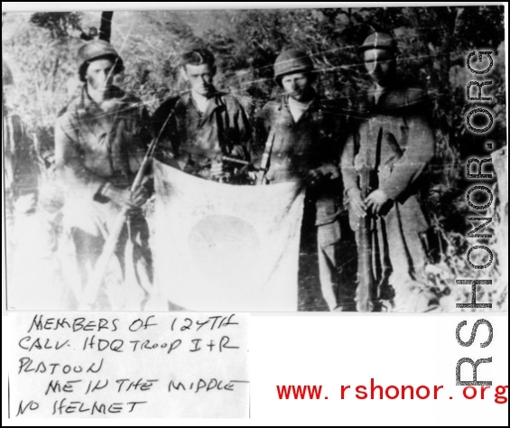 Members of 124th Cavalry Regiment (Mars Task Force), Headquarters Troops I & R, show of captured Japanese Good-Luck Flag  (寄せ書き日の丸) collected on the battleground in the CBI during WWII.