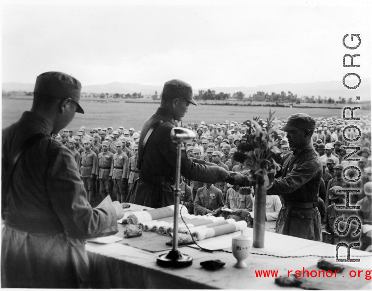 Chinese soldier of the 48th Army Division (陆军第四十八师) gets an award in a ceremony during a rally.