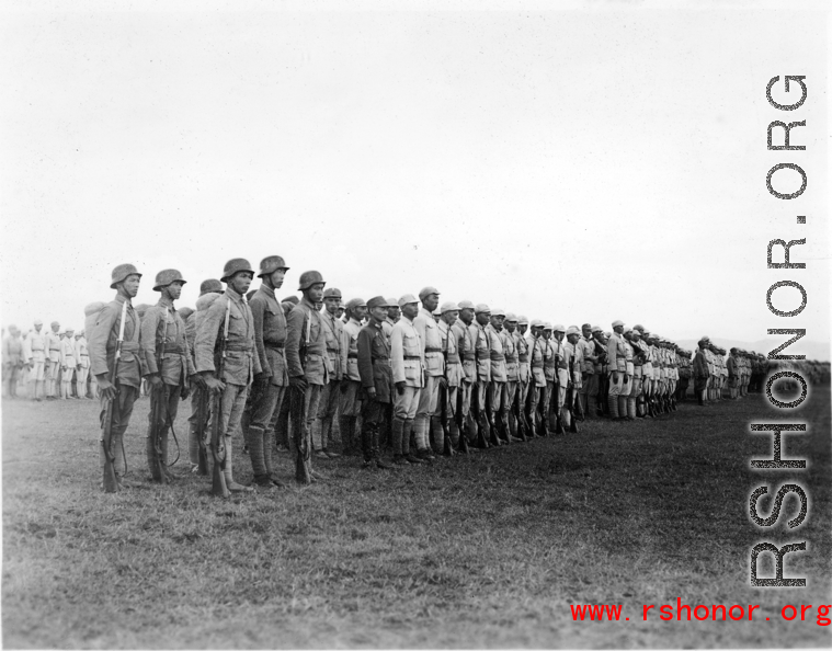 Chinese soldiers standing in ranks during exercises in southern China, probably Yunnan province, or possibly in Burma.