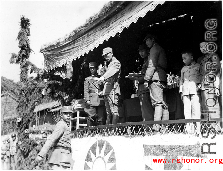 Chinese soldiers during in a ceremony as part of a shooting contest (射击比赛) in southern China, probably Yunnan province, or possibly in Burma.