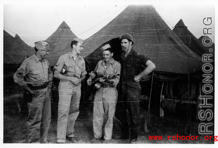 An image from the Roubinek Collection, showing American GIs and street scenes in India: GIs play music in front of tent in India.