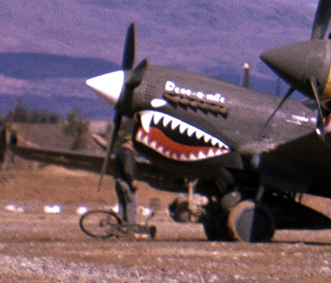 And note 'Dene-a-mite' at the far end, with an American standing nearby with his bicycle.