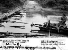Ferry and footbridge 13 miles east of  Ping Yang, which the Japanese had used during their retreat towards Liuzhou. Crossings like this one were bottlenecks that allowed attacks by 14th Air Force planes and Chinese ground troops. During WWII.