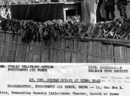 Lt. Gen. Dan I Sultan gives a speech at the Burma Road opening ceremonies at Wanting. In the background (left to right) are Maj. Gen. H. C Davidson, General C. L. Chennault.