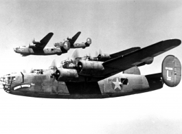 B-24s flying in a group. Possible tail-number of closest, nicknamed "Joney Bounce," is #124228. In the CBI.