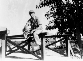 GI enjoying a moment sitting on a rail in Karachi, India, on the way back to the US after the war.