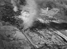 B-25s fly in front of Yishan (now Yizhou) in Guangxi province, SW China, among Karst peaks during the Japanese Ichigo campaign of summer and fall 1944. Towns along the Ichigo route were bombed by American planes as the Japanese moved into them, or sometimes in advance, to deny the resources of the towns to the incoming Japanese. The Japanese entered Yishan town on November 14, 1944, which should be the approximate date of this image. The Japanese stayed in Yishan until mid-June 1945, and allies bombed Yisha