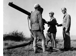 "Chinese troops get expert training from and American corporal at the Ramgarh Artillery School." During WWII.