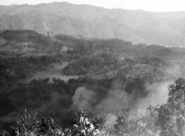 American troops of the 2nd Battalion, 279th Regiment, use a machine gun to fire upon Japanese positions on the Burma Road, at Loi Kang Burma. January 26, 1945.   Photo by Colgate.