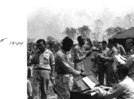 GIs singing during Church service in Chabua, India, during WWII.  Photo provided by Michael J. O'Brien to the editors of Ex-CBI Roundup (through reader submission) over many years of publication, and provided to the Remembering Shared Honor project.