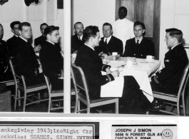 "Thanksgiving 1943. Left to right center clockwise: Shanks, Simo, Widmoyer, Wolf, Capt Ratchford, Von Breyman, Burke, Boldt, Simonette & Sullivan. Howard M. Sharp is the Black mess attendant, and presently a magician in Washington D. C., name of HOSHA."  Photo from Joseph J. Simon.