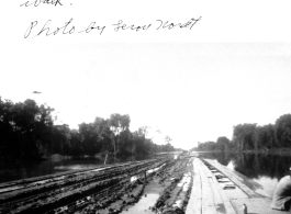 Causeway for convoy trucks to be built to the left of this temporary wood boardwalk somewhere in the CBI during WWII.  Photo by Leroy Nordt.