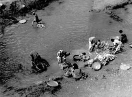 Local people wash vegetables and clothes in Yunnan province, China, during WWII.