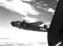 "Joyce Marie", a B-25H of the 491st Bomb Squadron, flies in formation somewhere in the CBI.  From the collection of Eugene Wozniak.