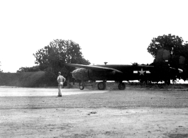 #41-30387, an American B-25B bomber, taxis onto the 'engine run up area'  at Yangkai, Yunnan province, in the CBI.  (Image from the collection of Eugene Wozniak)