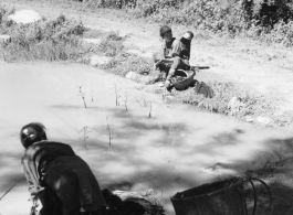 Local woman in Yunnan province, China, doing washing in a pond.  From the collection of Eugene T. Wozniak.