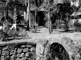 A village and stone bridge in Yunnan province, China, during WWII.  From the collection of Eugene T. Wozniak.