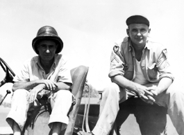 American GIs sitting on truck in the CBI, probably in Yunnan Province, China.