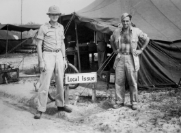 Lt. James C. Spaulding and T/Sgt Silvio C. Merlin pose in front of the "Local Issue" tent in India.    From the collection of David Firman, 61st Air Service Group.