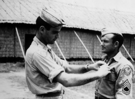 Capt. Bachrach gives and award or promotion to T/Sgt. Ingram. In Assam, India.    From the collection of David Firman, 61st Air Service Group.